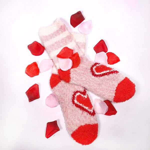 pink soft and fuzzy socks with hearts and stripes with rose petals